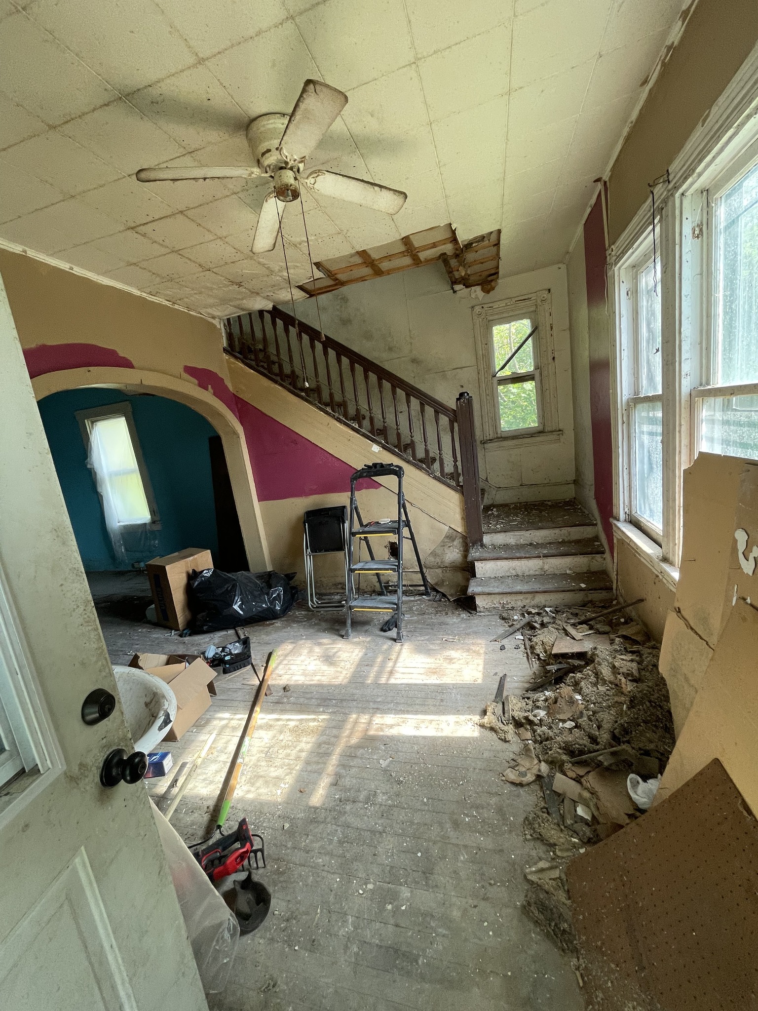 Heavily damaged home foyer and staircase — cash buyer Norristown PA