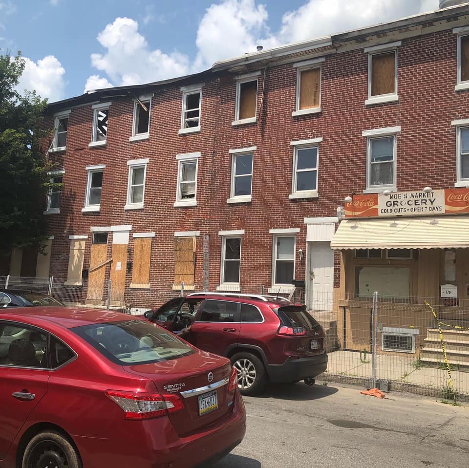 Distressed boarded-up Norristown rowhouse we buy as-is for cash